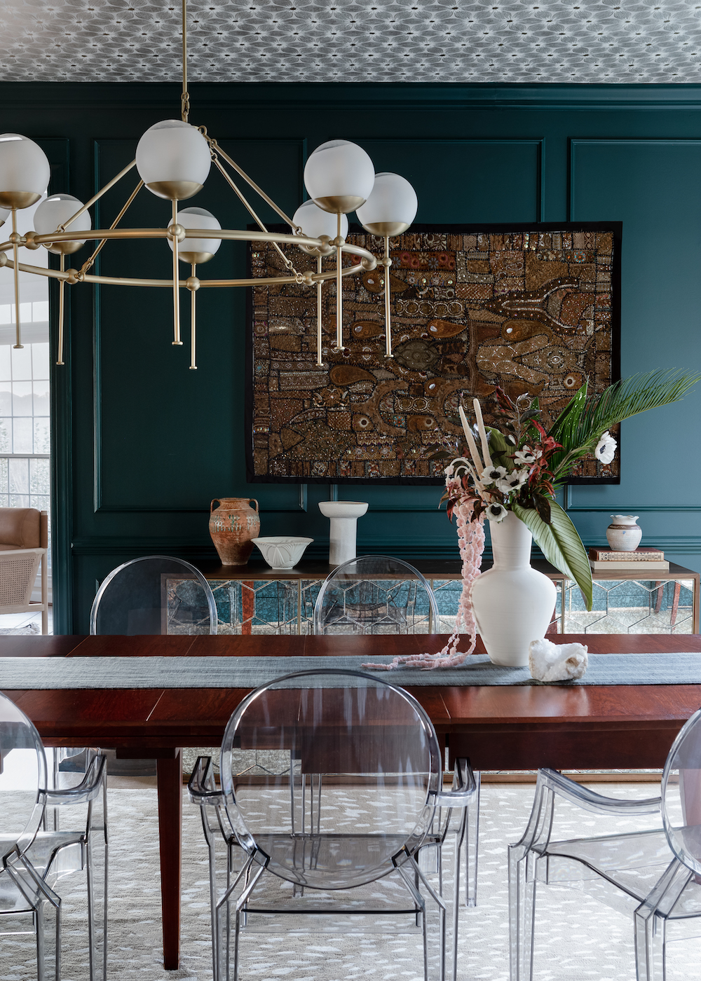 dark-teal-walls-clear-dining-chairs-dining-room-interior-design